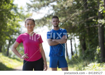 young couple preparing for a morning run young couple preparing for a morning run 84189527