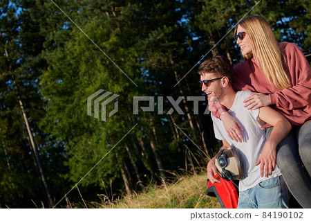 couple enjoying beautiful sunny day while driving a off road buggy couple enjoying beautiful sunny day while driving a off road buggy 84190102
