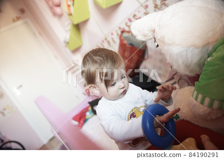 cute little one year old baby and making first steps cute little one year old baby and making first steps 84190291