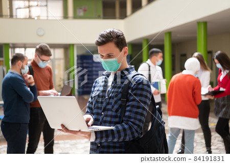 Portrait of multiethnic students group at university wearing protective face mask 84191831