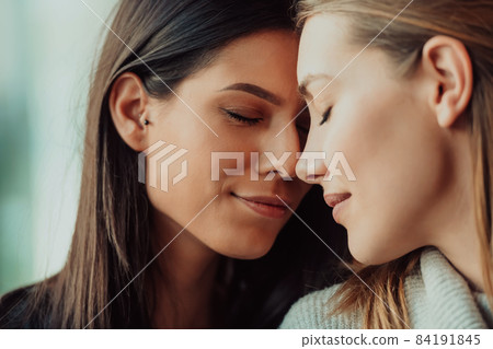 Diverse friends girls lesbian couple hugging. Stylish cool generation z women dating in love enjoy romantic relationships 84191845