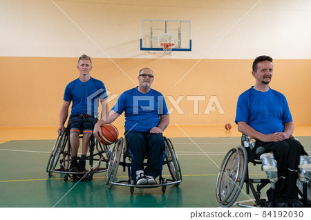 photo of the basketball team of war invalids with professional sports equipment for people with disabilities on the basketball court photo of the basketball team of war invalids with professional sports equipment for people with disabilities on the basketball court 84192030