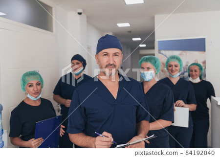 orthopedic doctor working together with his multiethnic team orthopedic doctor working together with his multiethnic team 84192040