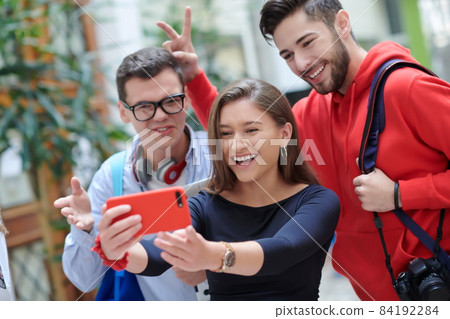 Group of multiethnic teenagers taking a selfie in school 84192284