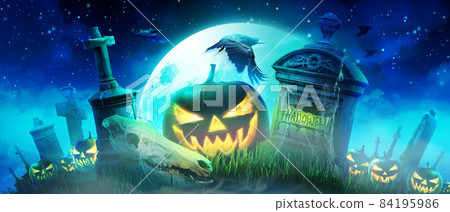 Halloween pumpkin face with burning fire inside in the graveyard. Halloween pumpkin face with burning fire inside in the graveyard. 84195986