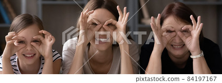 Portrait of happy three generations of women making funny faces 84197167