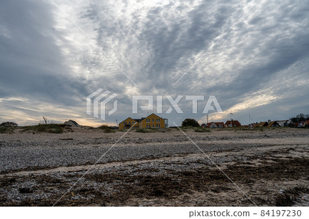 A beautiful dark sky over a beach. Picture from Gilleleje, Denmark A beautiful dark sky over a beach. Picture from Gilleleje, Denmark 84197230