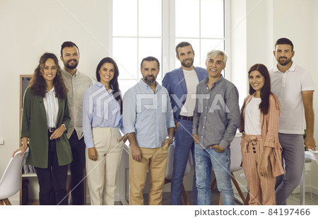 Teamwork, business and partnerships. Portrait of a diverse, friendly, positive and successful team of employees in the office. Men and women of all ages working together on projects and business tasks 84197466