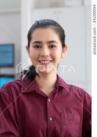 Portrait asian woman looking at camera smiling with confident and positive lifestyle. 84200094