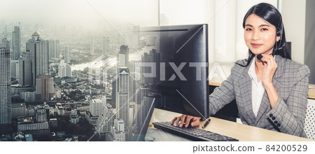 Business people wearing headset working in office broaden view 84200529