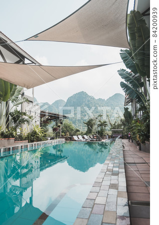 boutique hotel with pool in Vietnam overlooking the mountains. Blue crystal clear water 84200939