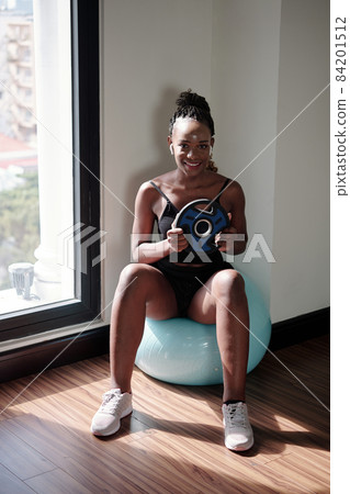 Sportswoman Doing Russina Twist Sportswoman Doing Russina Twist 84201512