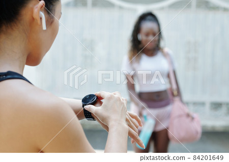 Sportswoman Checking Time on Smartwatch Sportswoman Checking Time on Smartwatch 84201649
