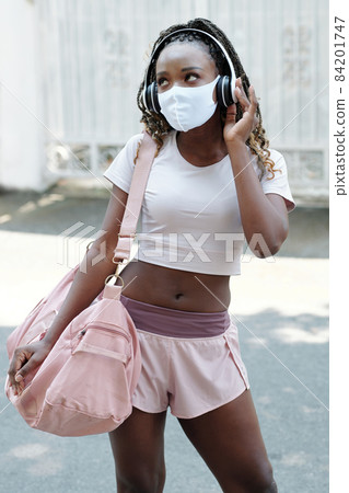 Fit Woman Listening to Music 84201747