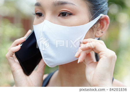 Serious Woman Talking on Phone Serious Woman Talking on Phone 84201836