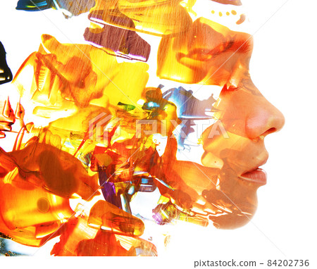 A profile portrait of a beautiful European girl combined with an abstract digital graphic in a double exposure technique 84202736