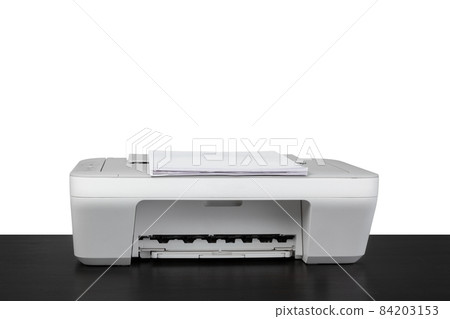 Laser home printer on table against white backgorund 84203153
