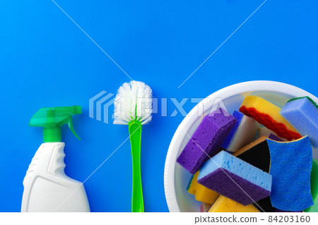 House cleaning supplies on blue color background 84203160