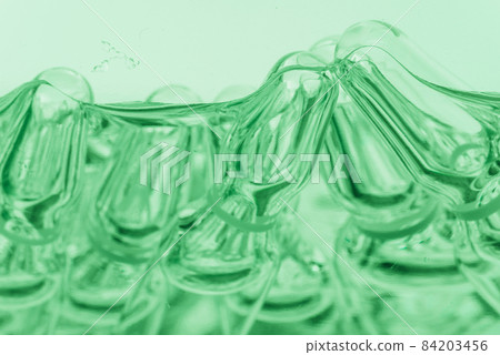 Glass medical ampoule vial for injection. Medicine is liquid sodium chloride with of aqueous solution in ampulla. Close up. Bottles ampule multicolor. Glass medical ampoule vial for injection. Medicine is liquid sodium chloride with of aqueous solution in ampulla. Close up. Bottles ampule multicolor. 84203456