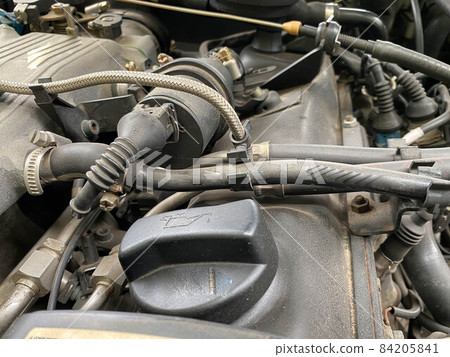 Top view of used engine and auto parts. Bad car maintenance concept Top view of used engine and auto parts. Bad car maintenance concept 84205841