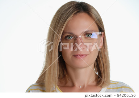 Beautiful blonde middle aged woman wearing glasses for better vision Beautiful blonde middle aged woman wearing glasses for better vision 84206156