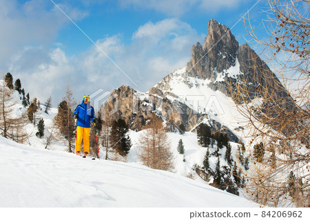Skier stand on slope in winter mountains Skier stand on slope in winter mountains 84206962