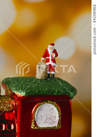miniature santa on a toy train locomotive 84206968