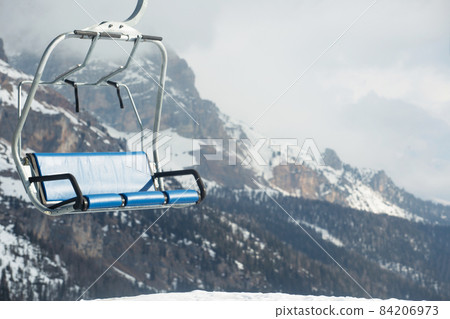 Ski lift chairs in winter mountains 84206973