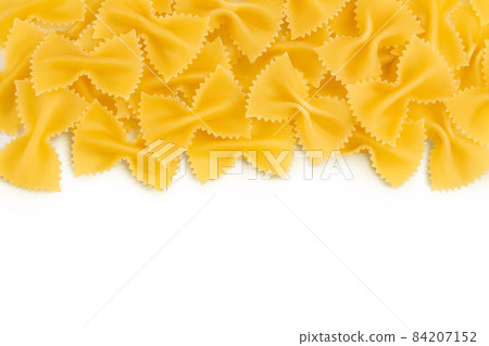Bow tie pasta isolated on white background with clipping path and full depth of field. Top view with copy space for your text. Flat lay. 84207152