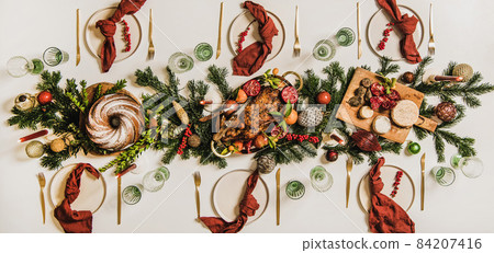 Flat-lay of Festive Christmas table setting over 84207416