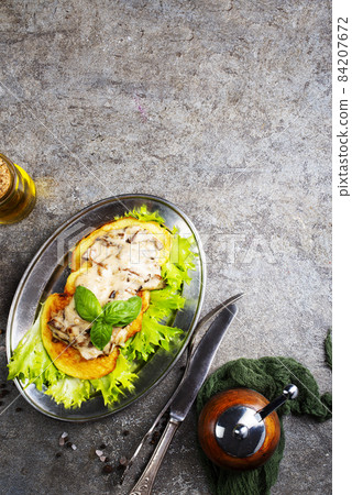 Fried potato pancakes with mushroom sauce Fried potato pancakes with mushroom sauce 84207672