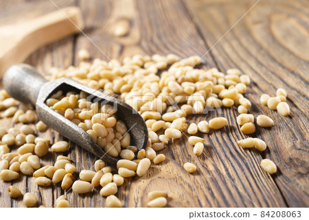 Pine nuts (cedar nuts). Delicious siberian product with nice taste and hale. Top view. 84208063