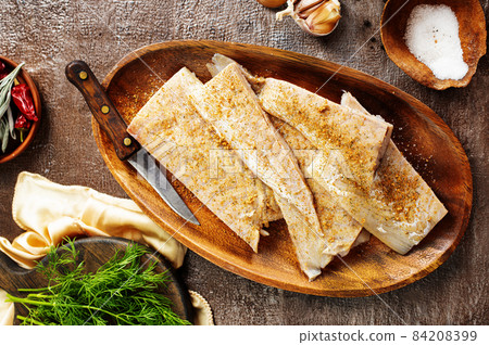 Fish fillet on a woodentray. white fish prepare for cooking Fish fillet on a woodentray. white fish prepare for cooking 84208399