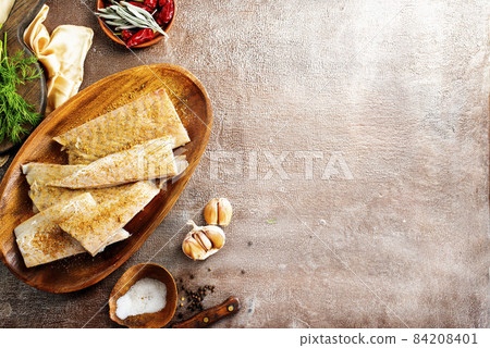Fish fillet on a woodentray. white fish prepare for cooking Fish fillet on a woodentray. white fish prepare for cooking 84208401