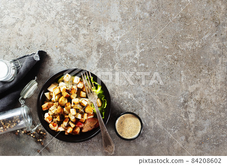 Healthy chicken salad with vegetables and croutons Healthy chicken salad with vegetables and croutons 84208602