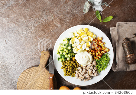 Ingredients for salad in transparent plates. 84208603