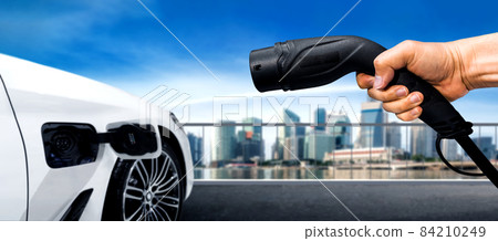 EV charging station for electric car in concept of green energy and eco travel 84210249