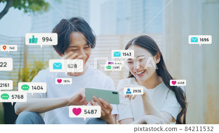 Couple watching SNS Couple watching SNS 84211532