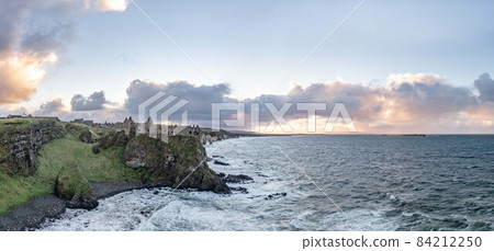 Dramatic sky above Dunluce Castle, County Antrim, Northern Ireland. Dramatic sky above Dunluce Castle, County Antrim, Northern Ireland. 84212250