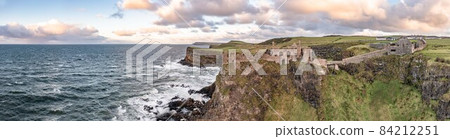 Dramatic sky above Dunluce Castle, County Antrim, Northern Ireland. Dramatic sky above Dunluce Castle, County Antrim, Northern Ireland. 84212251
