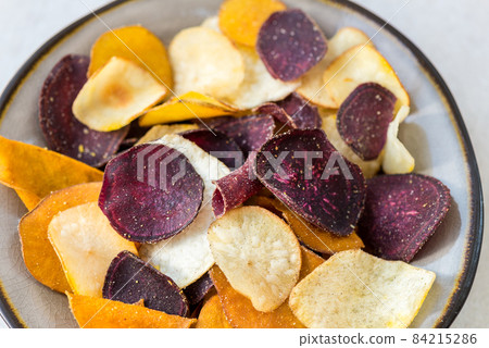 Bowl of Healthy Snack from Vegetable Chips, such as Sweet Potato 84215286