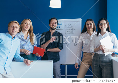 Portrait of business people standing together in a boardroom 84215857