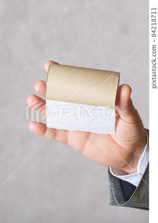 A man and a finished toilet paper roll A man and a finished toilet paper roll 84218711