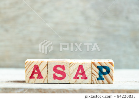 Alphabet letter block in word ASAP (Abbreviation of as soon as possible) on wood background Alphabet letter block in word ASAP (Abbreviation of as soon as possible) on wood background 84220833