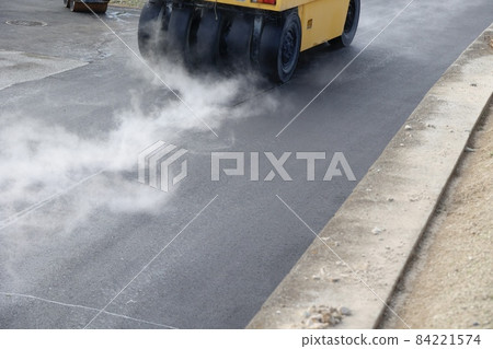 Tire rollers on the road pavement 84221574
