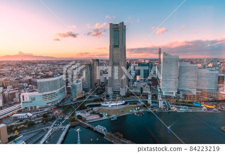 Yokohama cityscape of Japan: Overlooking the cityscape of Yokohama and the Yokohama Landmark Tower that shine in the sunset 84223219