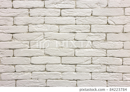 Close-up of white painted whitewashed solid brick wall. Abstract copy space background, Bricklaying, construction and masonry concept. Close-up of white painted whitewashed solid brick wall. Abstract copy space background, Bricklaying, construction and masonry concept. 84223784