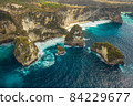 Aerial shot at sea with turquoise water and rocks. Atuh beach, Nusa Penida, Bali, Indonesia. 84229677