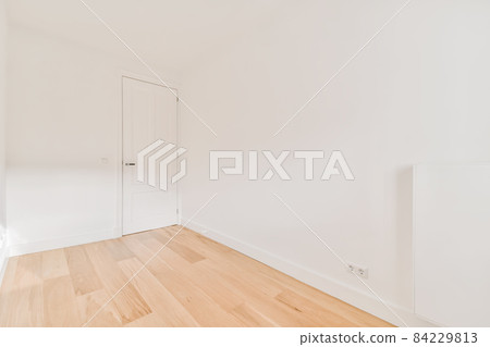 Pretty bright empty room with white walls Pretty bright empty room with white walls 84229813
