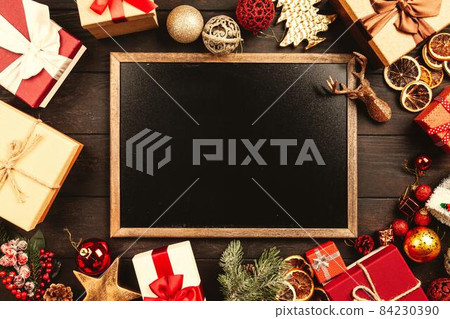 Christmas background with gift boxes on wooden table 84230390